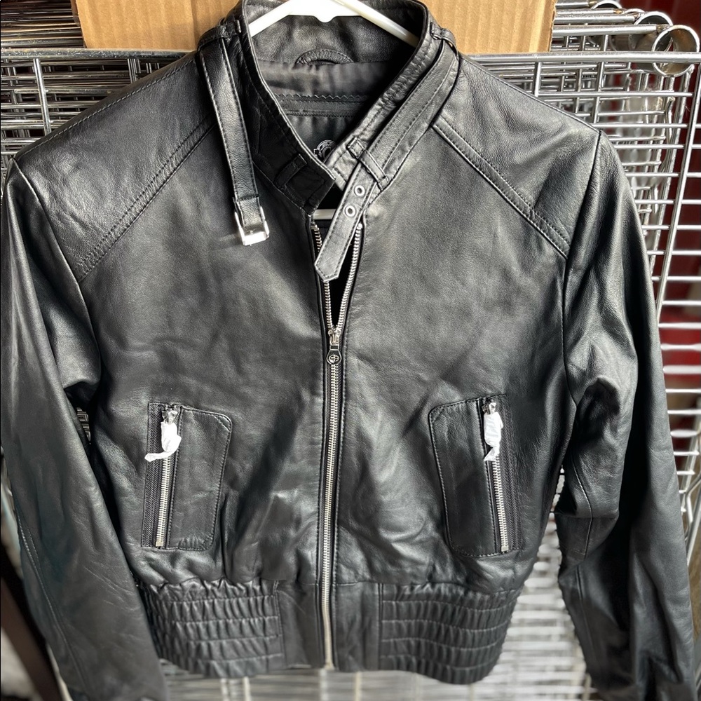 New black leather jacket . Size M . Never worn